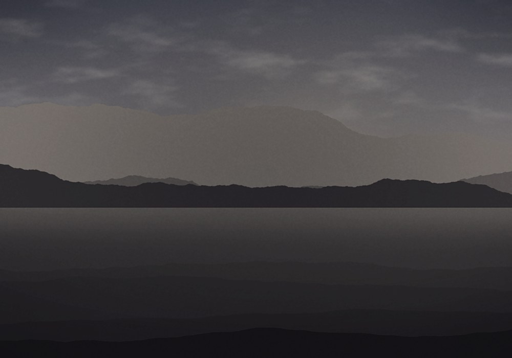 A flat, underexposed photograph of a valley before editing